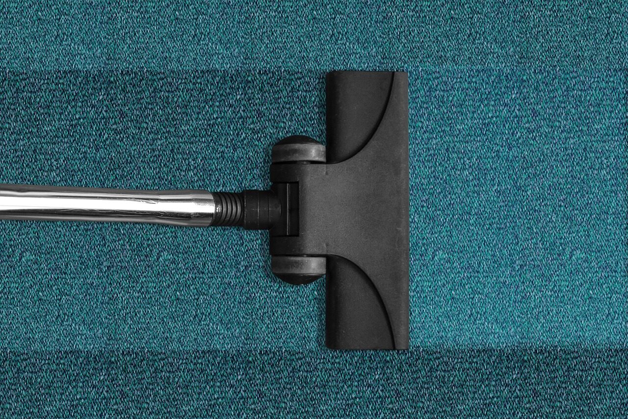 vacuuming a carpet