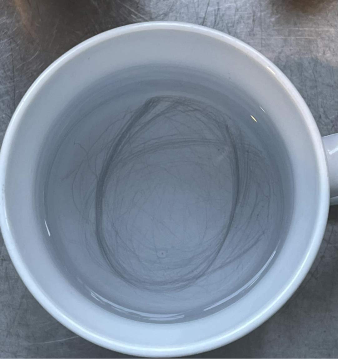 pencil-like scribbles on mugs