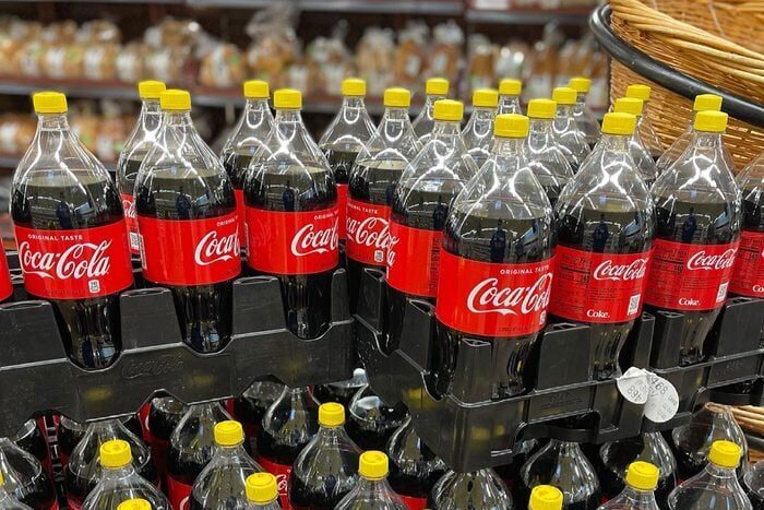 coca-colas with yellow caps