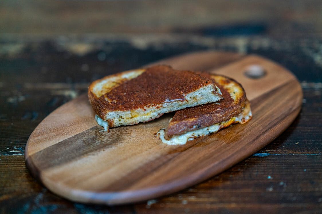 cheese sandwich on a wooden board
