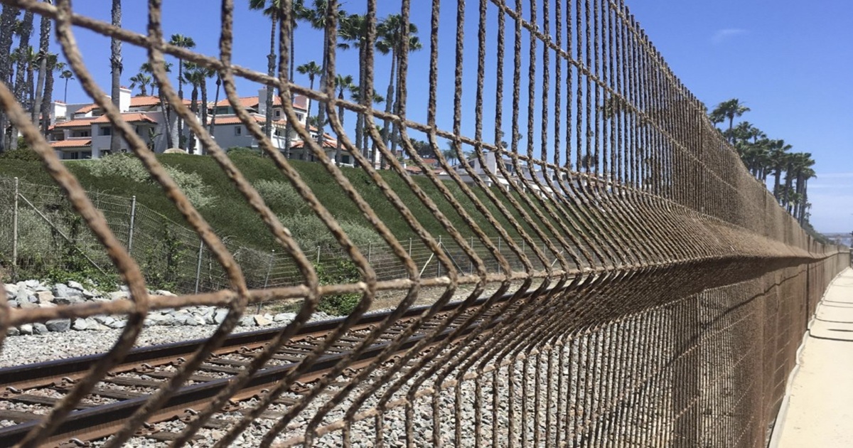 The Real Reason These Train Track Fences Look “Bent”