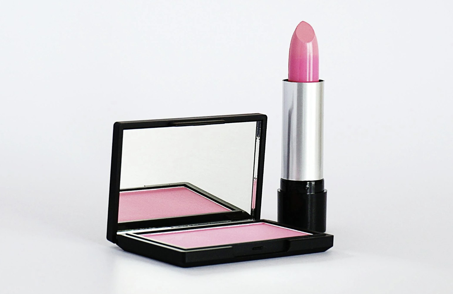 Close-Up Photo of Pink Lipstick and Blush-On
