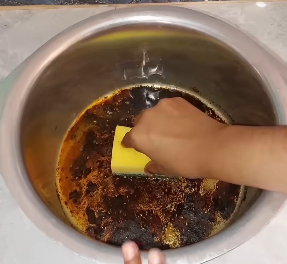 scrubbing a pot