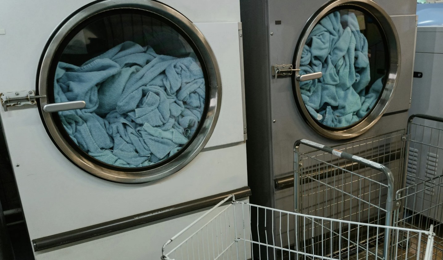 a washing machine with blue fabric in it