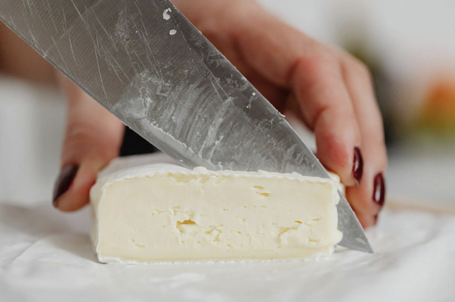 slicing white cheese