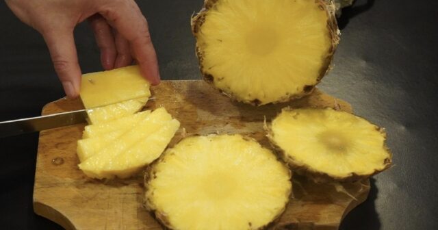 cutting pineapple