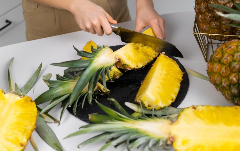 cutting pineapple